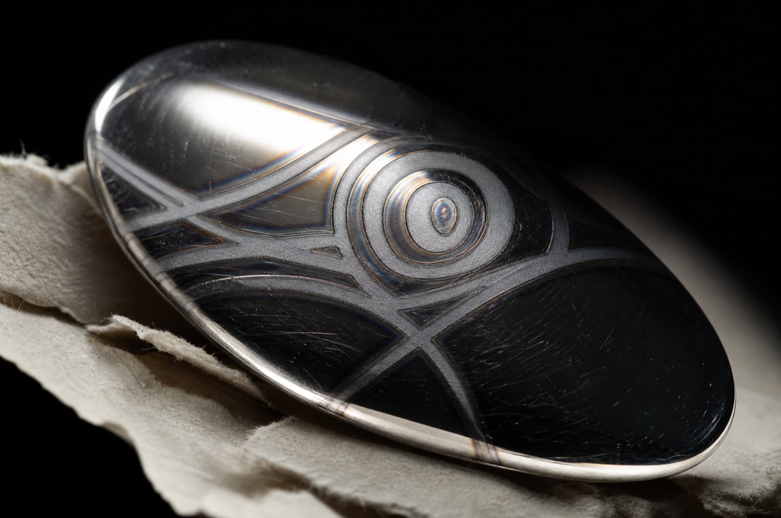 Macro of laser engraving on polished silver