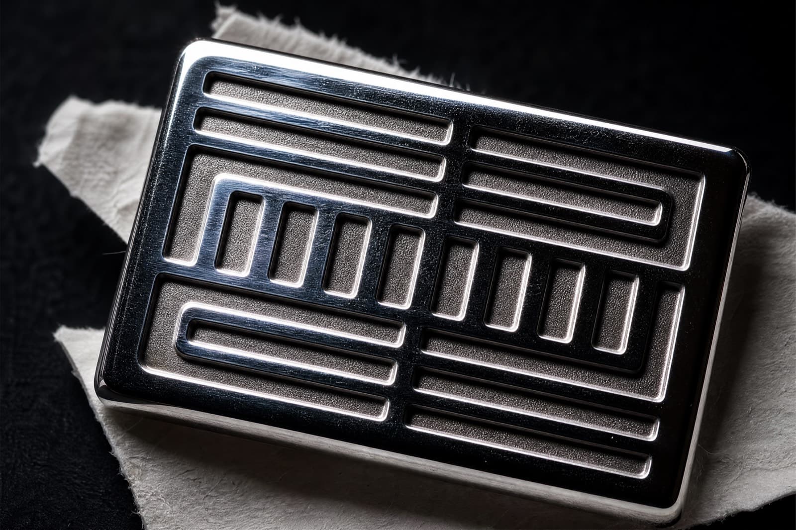 Macro of machine engraving on polished silver